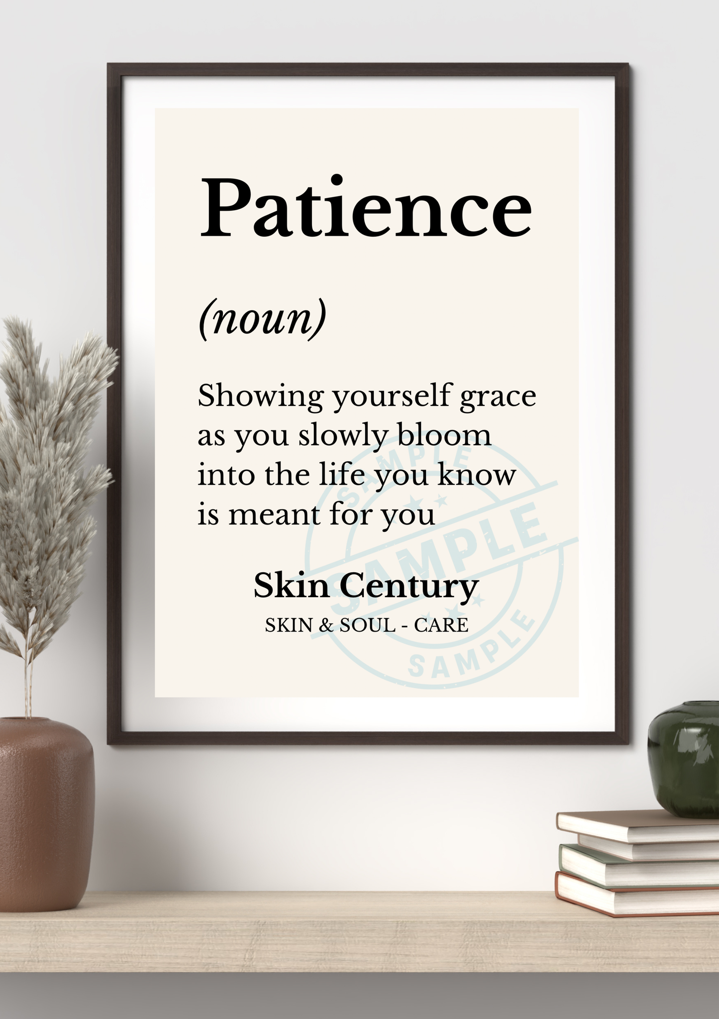 Framed print with the definition of 'Patience' on a shelf with decorative items.