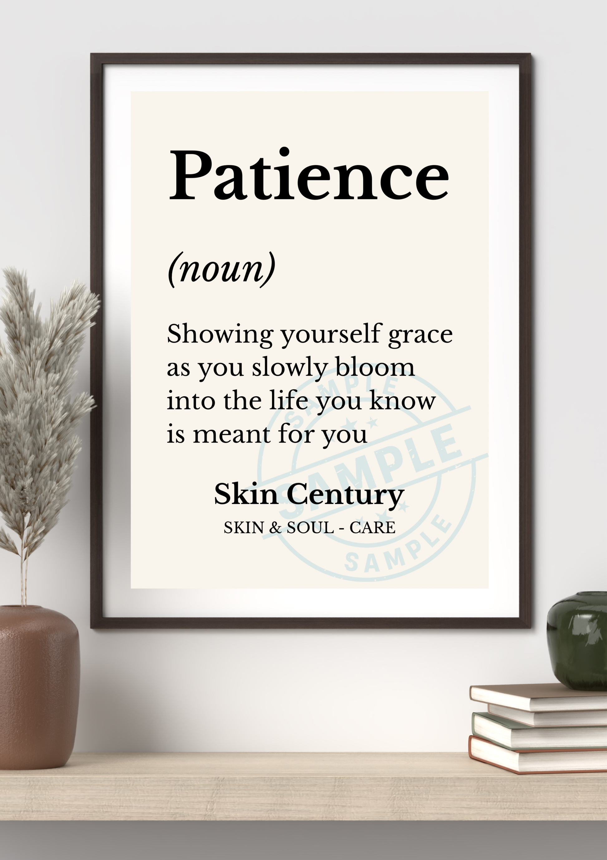 Framed print with the definition of 'Patience' on a shelf with decorative items.
